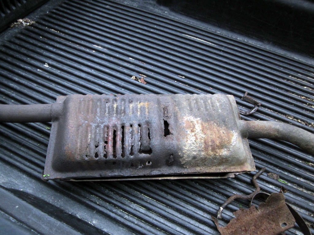 Here is the old rusty muffler from my 2000 Ford Ranger...it looks like it has gills and all the exhaust comes out the side instead of the tailpipe.