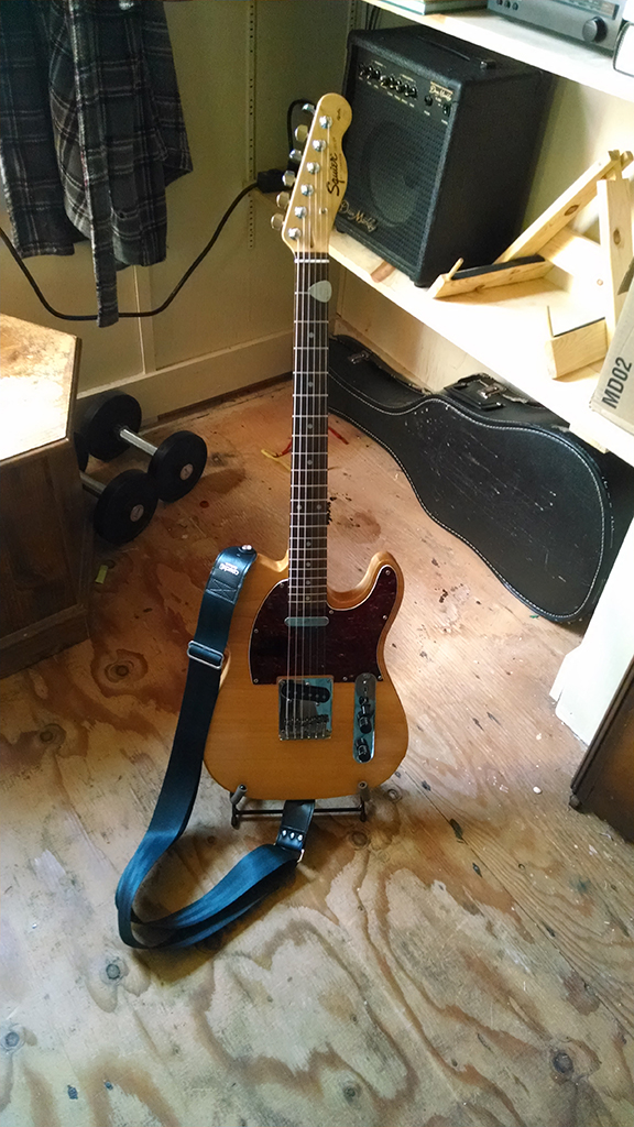 My Telecaster sitting in it's new String Swing stand and wearing it's new Couch guitar strap.